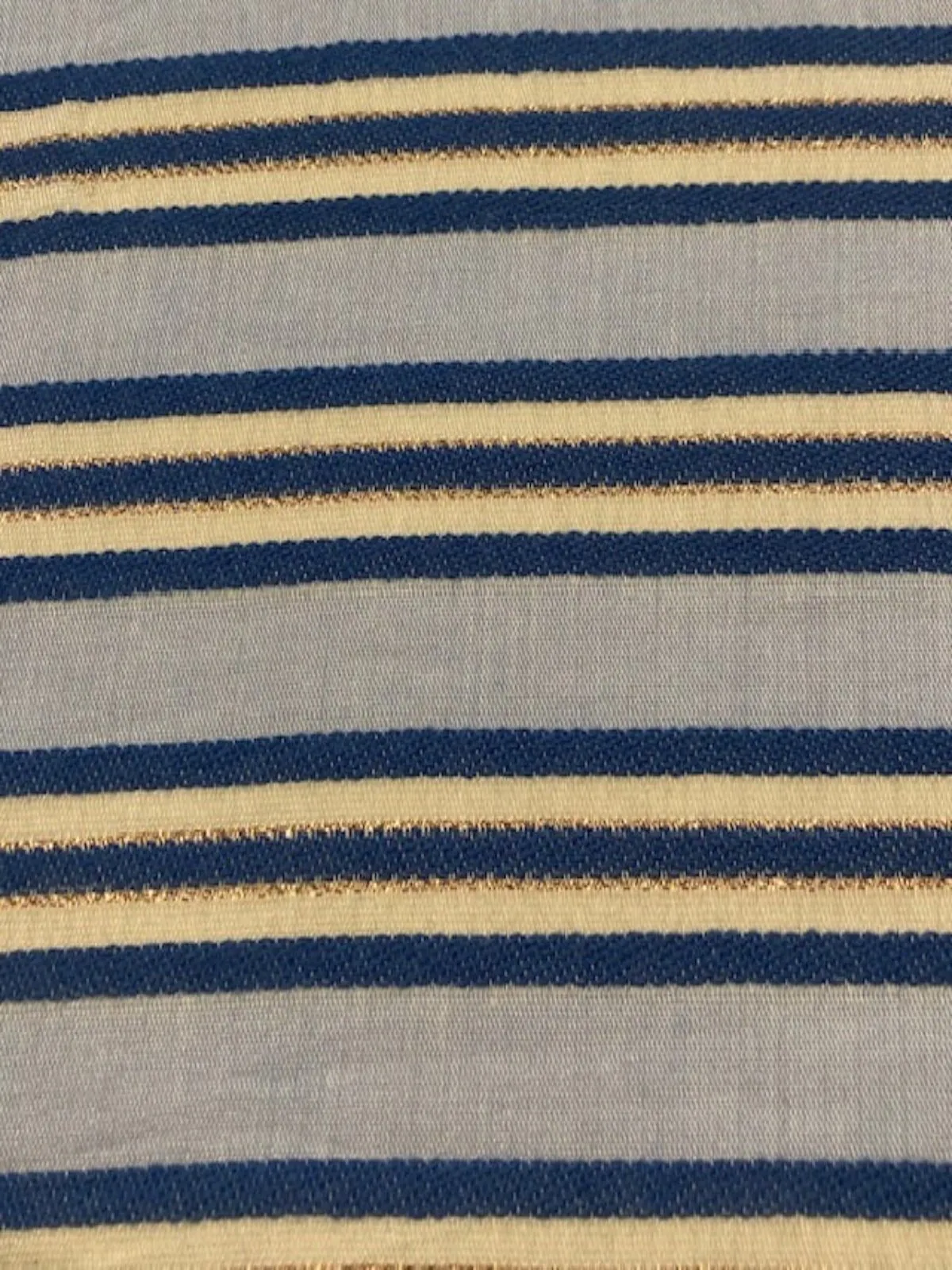 Blue Raised Stripe on Sky Blue with Bronze Lurex. Stripes run across the fabric. Lightweight.